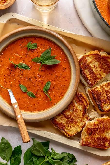 Freshly picked Genovese basil sprigs (Ocimum basilicum)